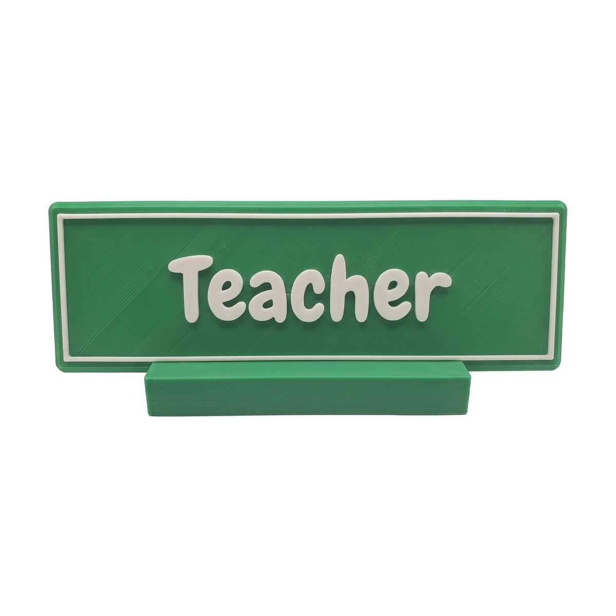 Example personalisation: Small green desk name plate and foot with white raised lettering and border reading Teacher