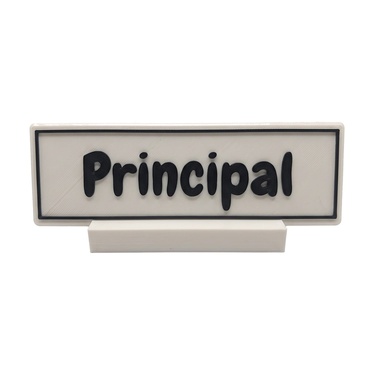 Example personalisation: Small white desk name plate and foot with black raised lettering and border reading Principal