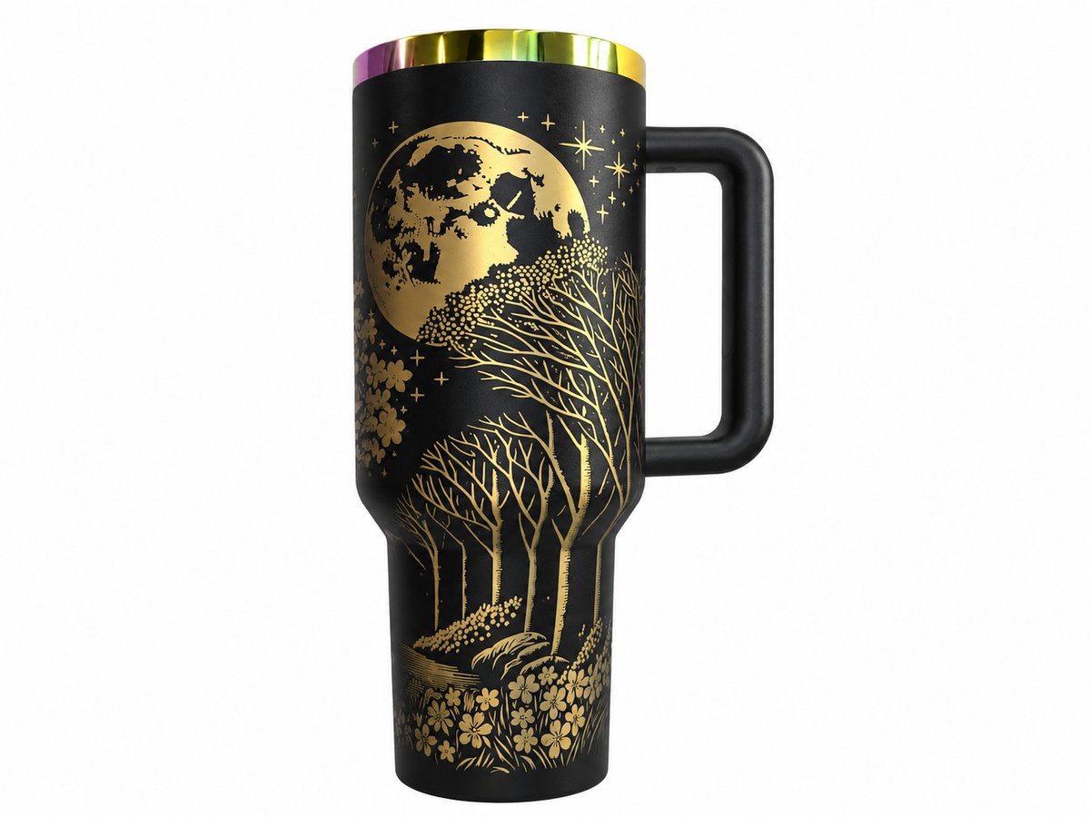Matte black 40 oz tumbler engraved in gold with a full moon, trees and blossoms under an iridescent rainbow rim
