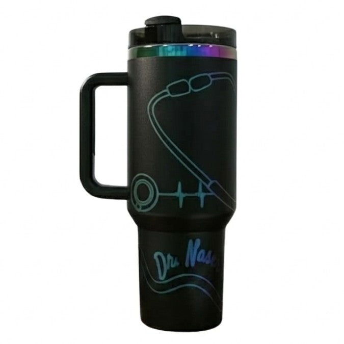 Matte black 40 oz tumbler with an iridescent engraved stethoscope, heartbeat line and a doctor's name in script