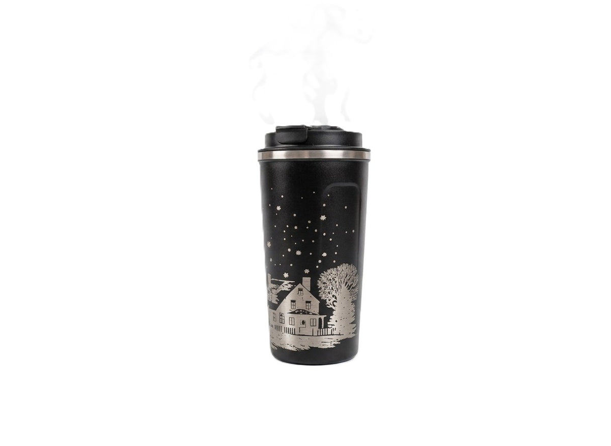Black stainless steel smart LED mug engraved with a snowy house, bare trees and a starry night sky, steam rising