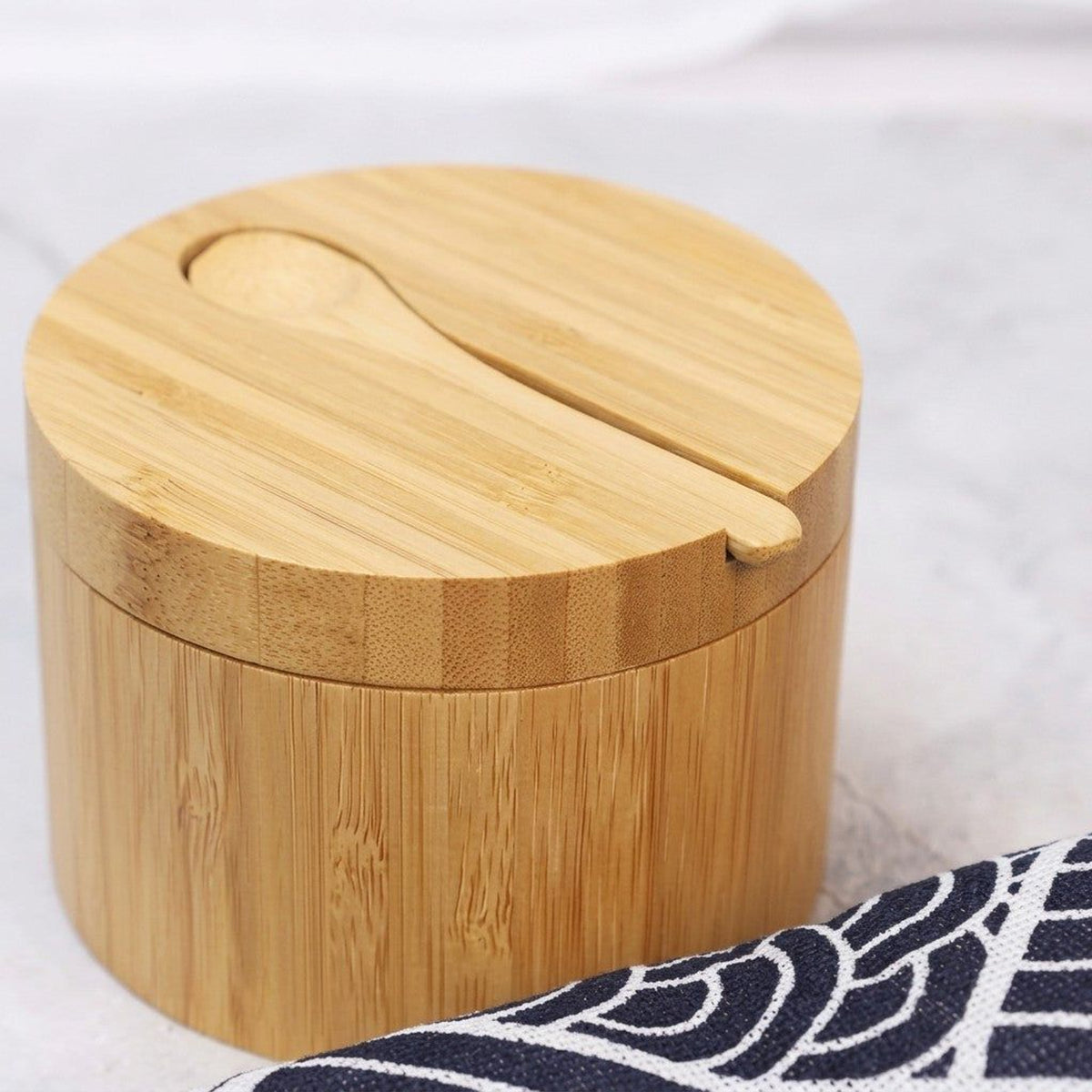 Close-up of the bamboo salt cellar lid with its built-in spoon slot