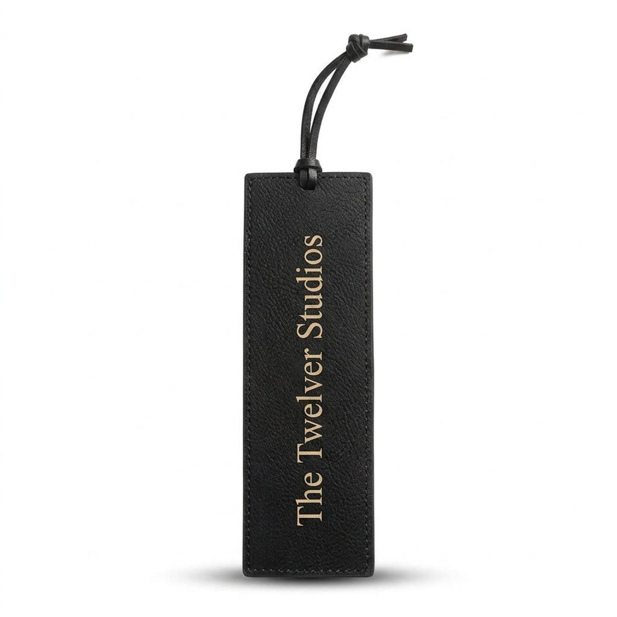 Black PU leather bookmark with cord tie, engraved in gold with The Twelver Studios, on white